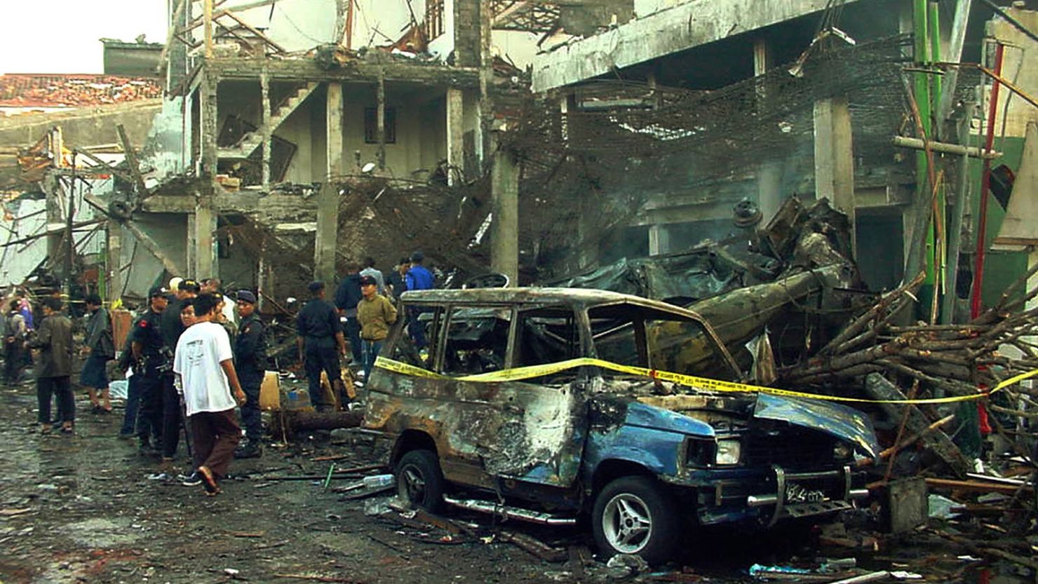 Police officers inspect the ruins of a nightclub destroyed by an explosion in Denpasar, Bali, Indonesia, on October 13, 2002.