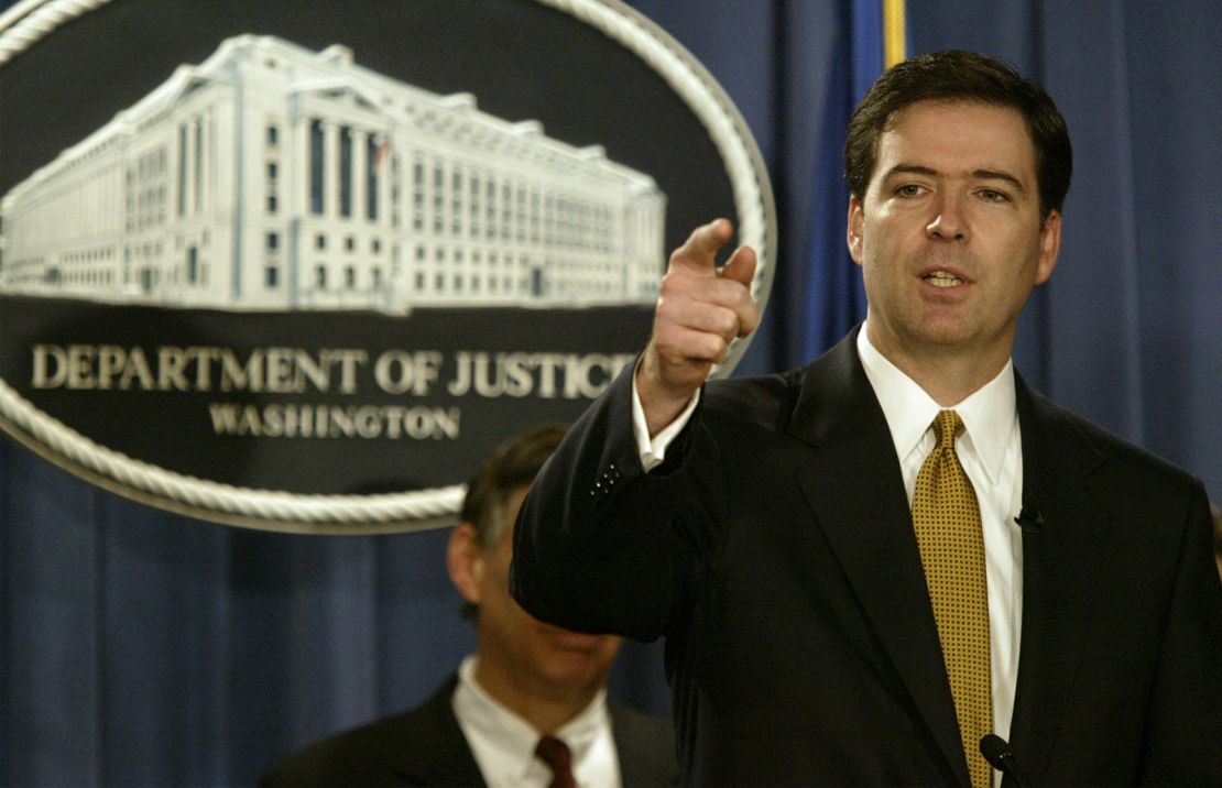 James Comey, then deputy attorney general, gestures during a news conference on January 14, 2004, in Washington, DC.