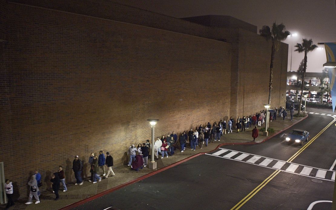 Bargain seekers line up outside a California mall in 2004 as retailers begin to open earlier on Black Friday.