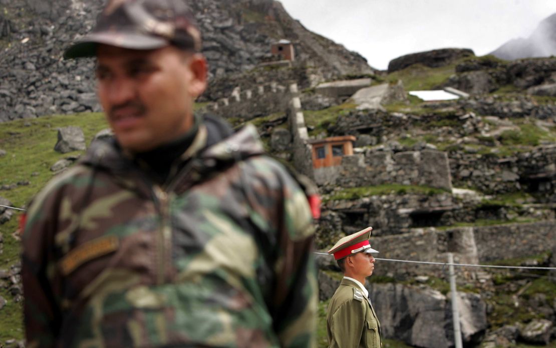 An Indian soldier and a Chinese soldier guard their respective territories at Nathu La Pass, along the border between the northeastern Indian state of Sikkim and Tibet in 2006.