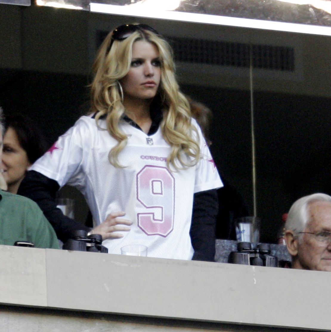 Jessica Simpson wears Dallas Cowboys quarterback Tony Romo's jersey number at a 2007 Eagles-Cowboys football game in Texas.