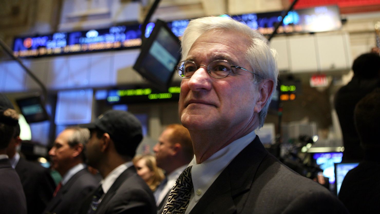 Rick Dreiling, former Chairman and CEO of Dollar General, looks on at the stock lists for trading at the New York Stock Exchange in 2009