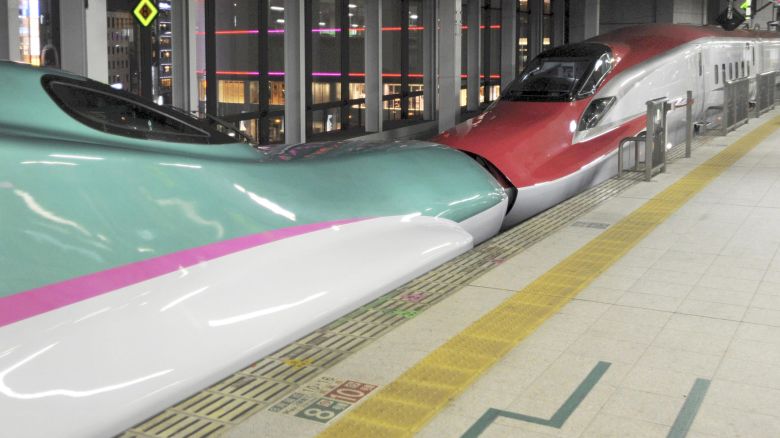 JR East Japan Railway Company conducts its first test operation with Tohoku Shinkansen's E5(green) coupled with Akita's E6 (red) between the Sendai and Kitakami Station, onTuesday midnight, in Miyagi Prefecture, Oct. 26, 2010. The E5 Series, Hayabusa, the successor to Hayate will run on the track the Shin-Aomori due to open in 2011. New E6 shinkansen trains will be introduced on Komachi services in 2013, ( The Yomiuri Shimbun via AP Images )