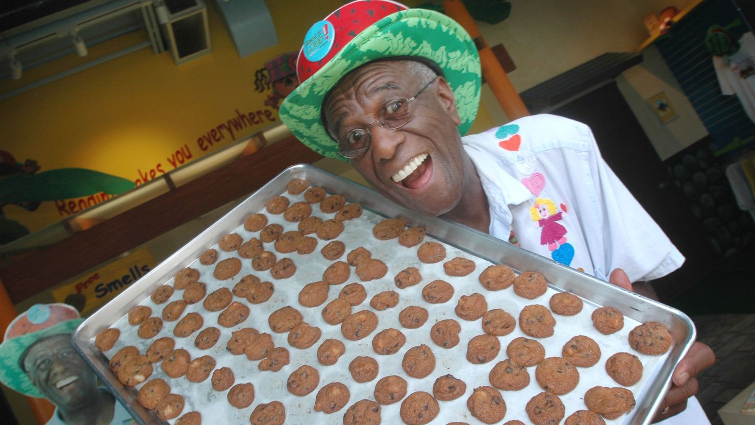 Amos shows off a sheet of cookies in his home office in the Lanikai section of Kailua, Hawaii, in 2007.