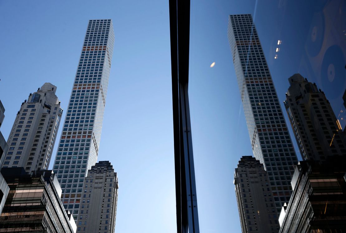 The 432 Park Avenue tower seen reflected in the glass of another skyscraper in Manhattan, New York.