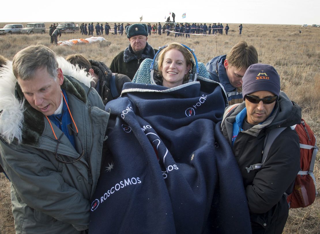 NASA astronaut Kate Rubins is carried to a medical tent after she is helped out of the Soyuz MS-01 spacecraft in October 2016.