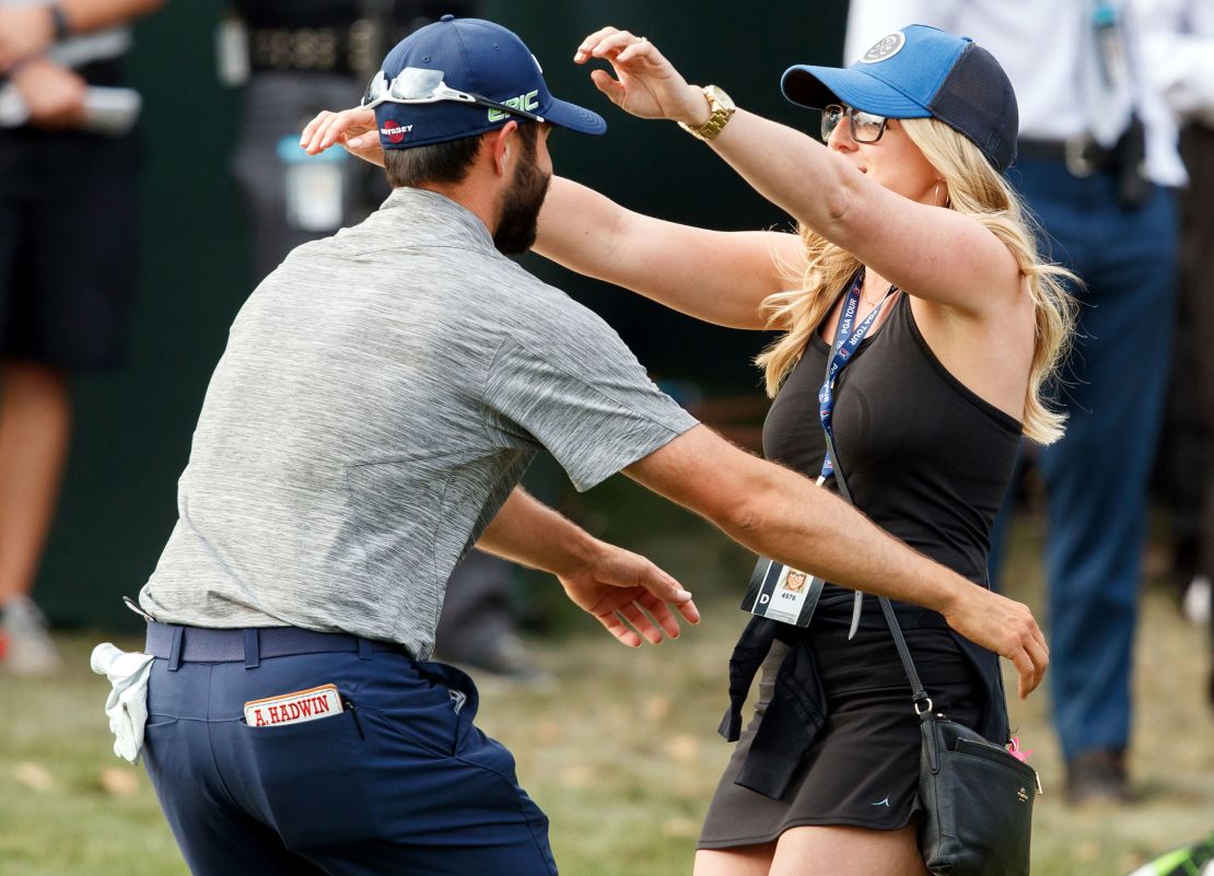 Hadwin hugs his then-fiance Jessica after clinching his first PGA Tour title at the 2017 Valspar Championship.