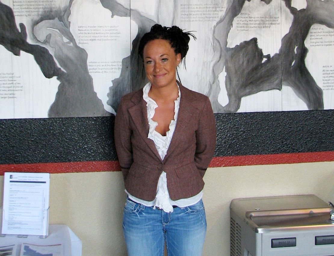 Rachel Dolezal, then a leader of the Human Rights Education Institute, stands in front of a mural she painted at the institute's offices in Coeur d'Alene, Idaho, on July 24, 2009.
