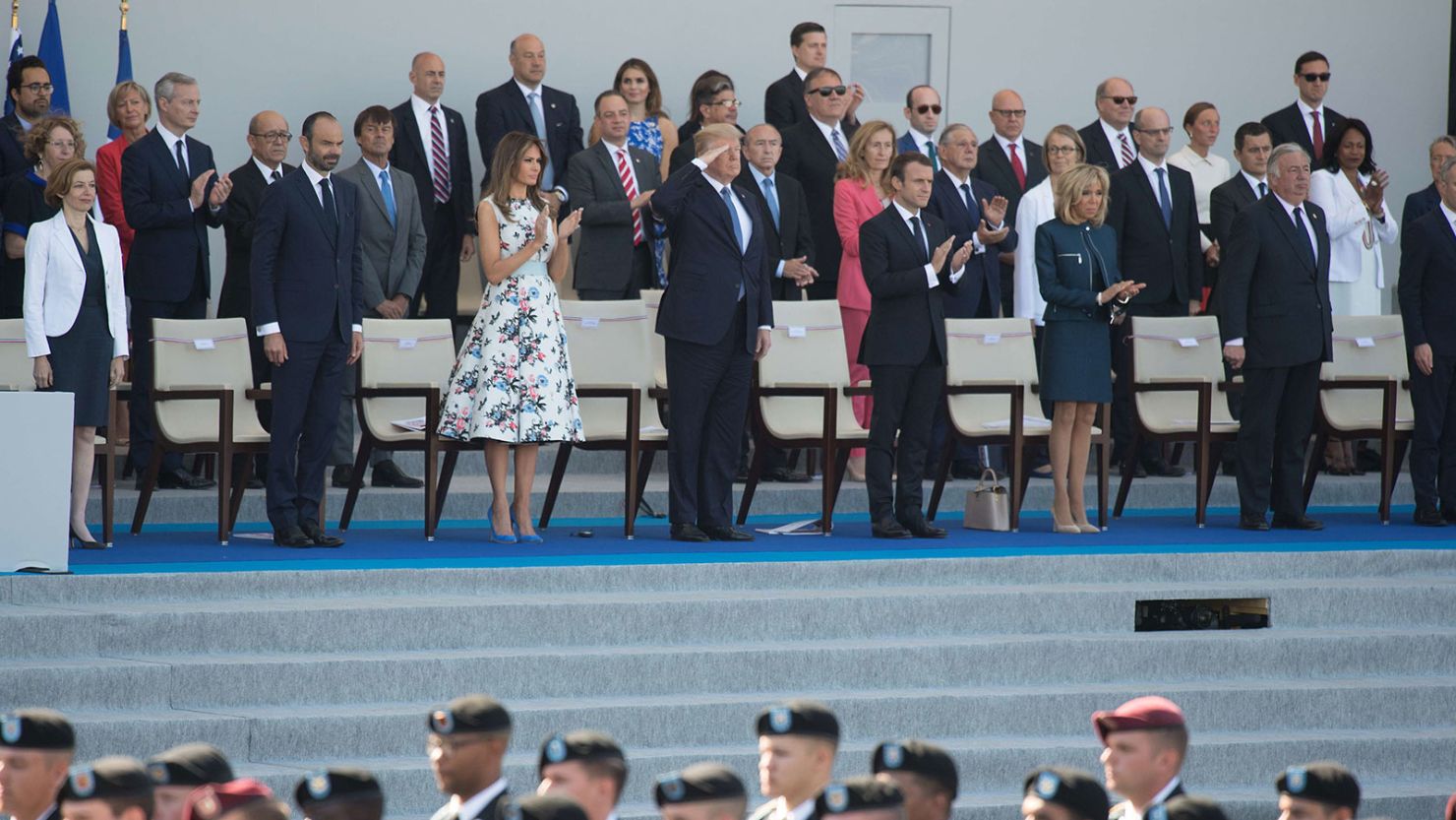 President Donald Trump and First lady Melania Trump, center, attend the traditional Bastille Day military parade on the Champs-Élysées in Paris on July 14, 2017.