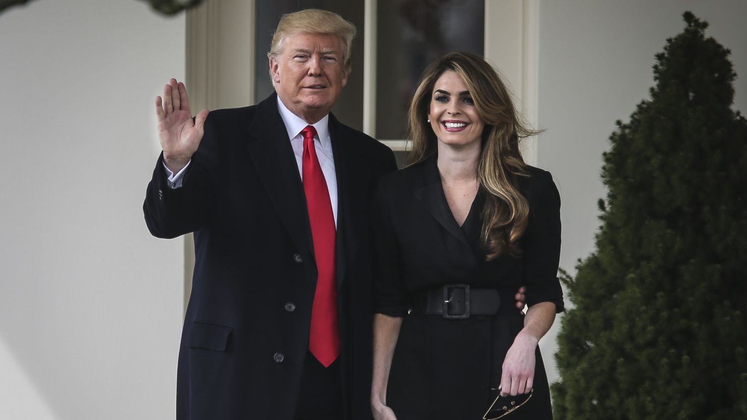 Then-President Donald Trump stands next to Hope Hicks before boarding Marine One on the South Lawn of the White House on March 29, 2018, in Washington.