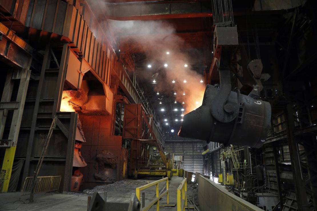 A giant ladle backs away after pouring its contents of red-hot iron into a vessel in the basic oxygen furnace as part of the process of producing steel at the US Steel Granite City Works facility in a 2018 file photo.