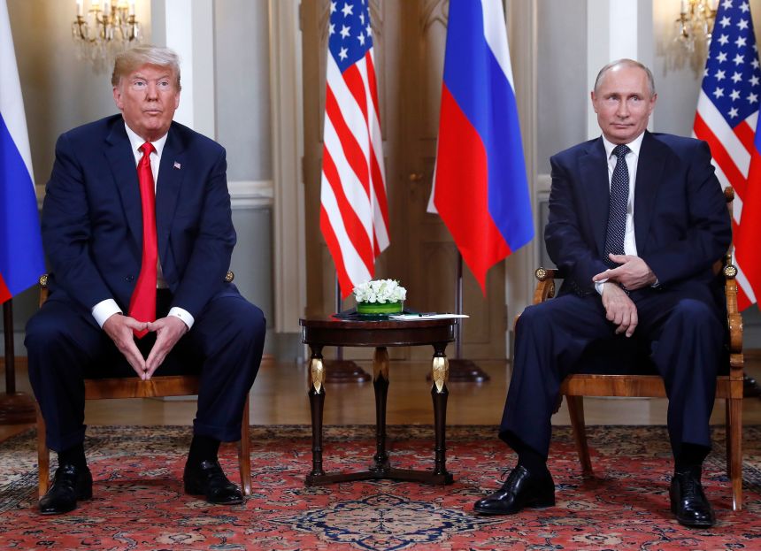 President Donald Trump and Russian President Vladimir Putin sit at the beginning of a one-on-one meeting at the Presidential Palace in Helsinki, Finland, Monday, July 16, 2018.