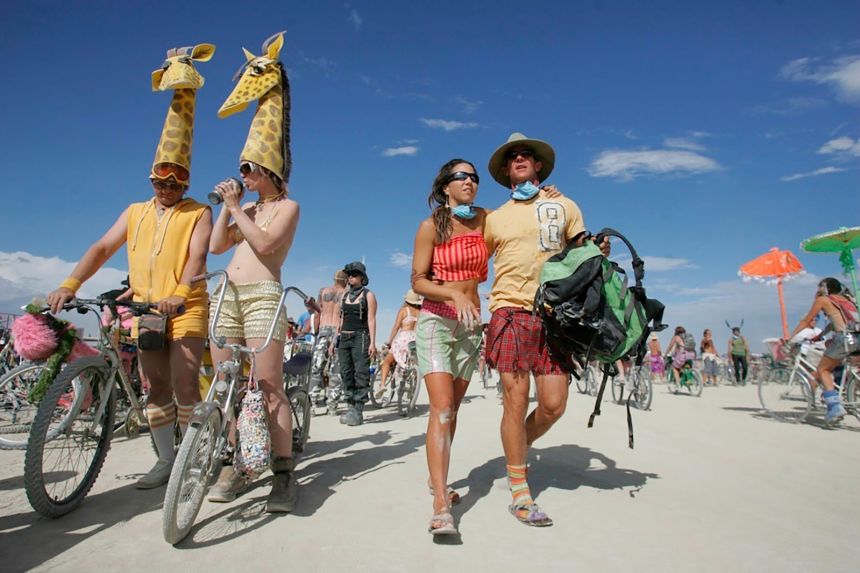 Burners visit the Center Camp in Gerlach, Nevada, in 2007. Participants often travel between and visit various camps.