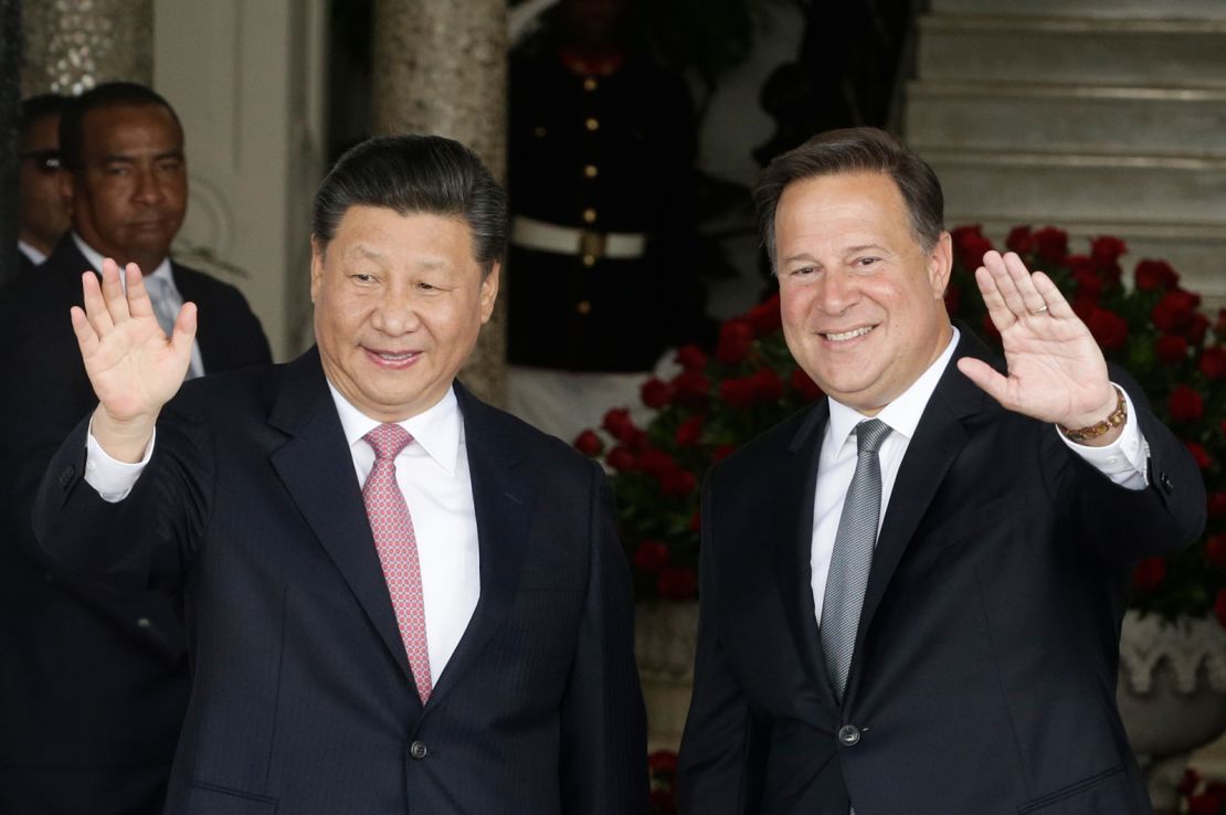 Chinese leader Xi Jinping and Panama's then-President Juan Carlos Varela wave from the front steps of the presidential palace in Panama City in 2018.