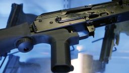 In this October 2017 photo, a bump stock is attached to a semi-automatic rifle at the Gun Vault store and shooting range in South Jordan, Utah.