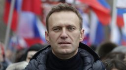FILE - In this Sunday, Feb. 24, 2019 file photo, Russian opposition activist Alexei Navalny takes part in a march in memory of opposition leader Boris Nemtsov in Moscow, Russia. The European Court of Human Rights ruled Tuesday April 9, 2019, that a Russian court order placing opposition leader Alexei Navalny under house arrest in 2014 was unlawful and politically driven. (AP Photo/Pavel Golovkin, File)