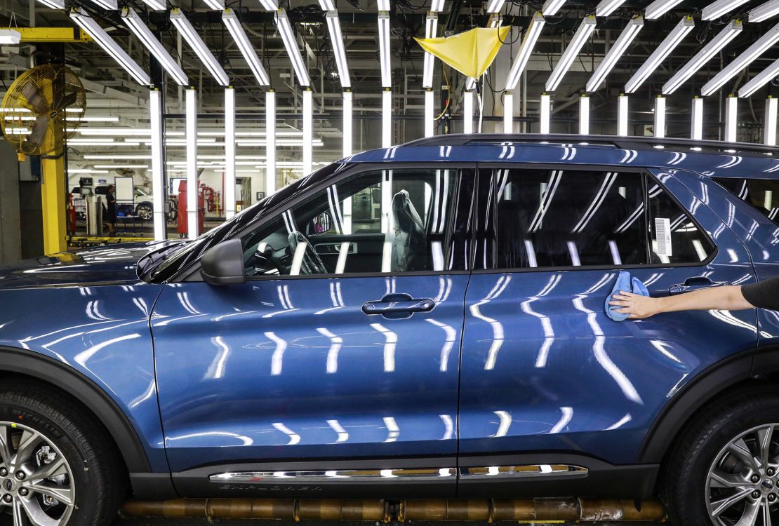 A Ford employee works on an Explorer line at the company's Chicago assembly plant in 2019. Ford reportedly shut the plant for a week due to the lack of rare earth magnets needs to build the car, according to experts, although Ford would not confirm or deny that was the reason for the shutdown.