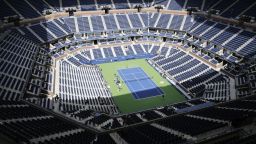 In this file photo from Aug. 27, 2017, players practice at the empty Arthur Ashe Stadium at the U.S. Open tennis tournament in New York. New York City's comptroller says the organizers of the U.S. Open tennis tournament owe the city $311,000 in back rent for use of the tournament site in Queens. (AP Photo/Peter Morgan)