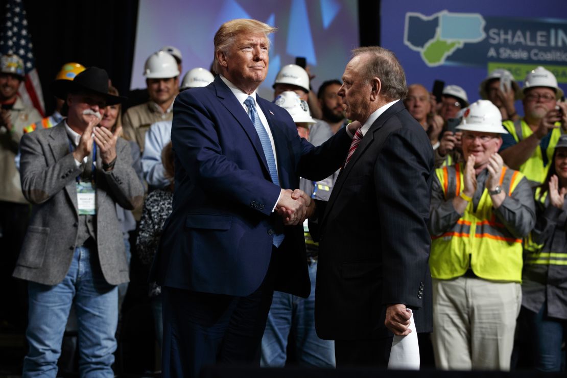 President Donald Trump shakes hands with Continental Resources CEO Harold Hamm at an event in Pittsburgh in 2019.