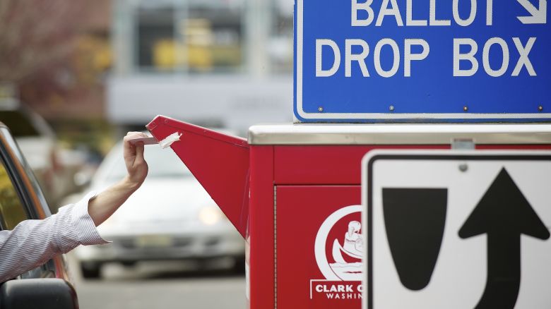 A ballot drop box was inundated with occasional lines of motorists waiting to drop their ballots off Monday, Nov. 5, 2012 in Vancouver, Wash. (AP Photo/The Columbian, Troy Wayrynen)