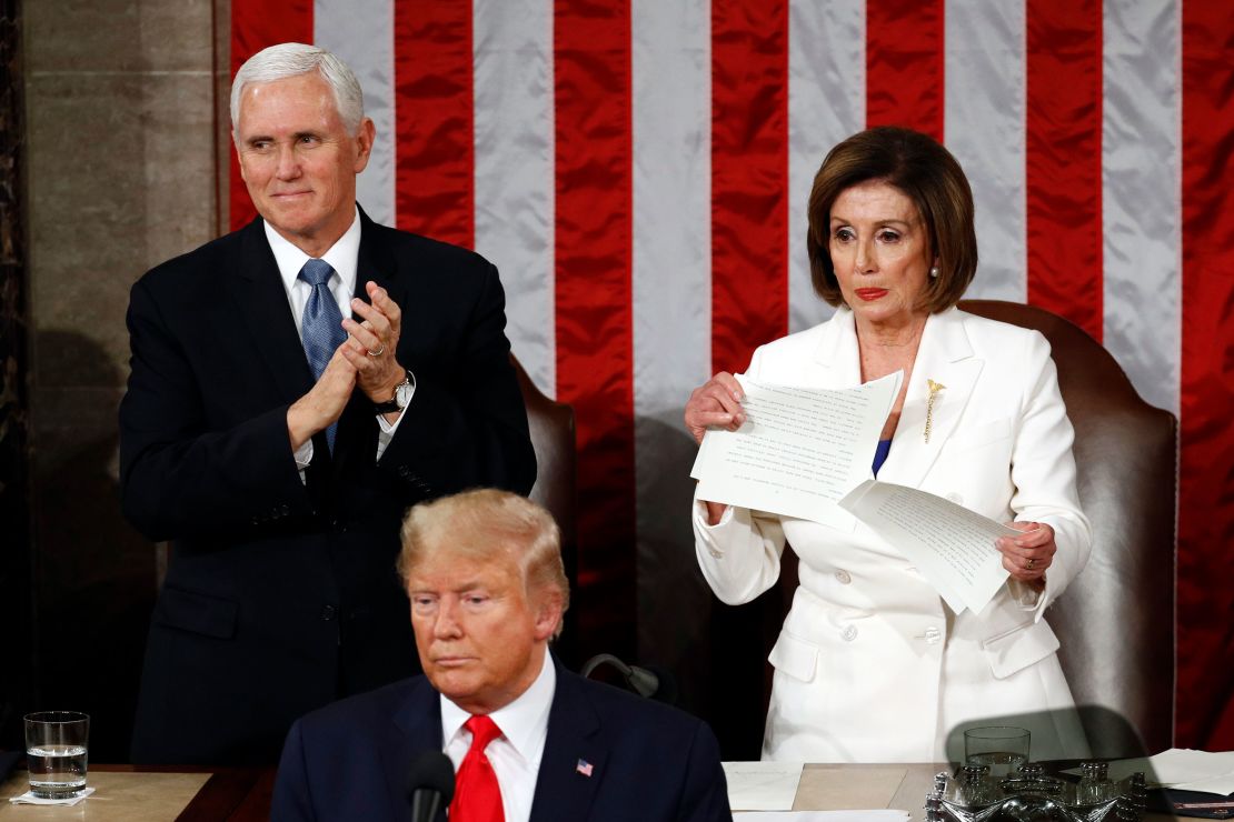 House Speaker Nancy Pelosi tears her copy of President Donald Trump's State of the Union address after he delivered it to a joint session of Congress on February 4, 2020. Vice President Mike Pence is at left.