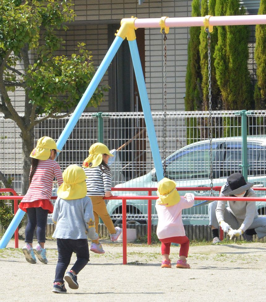 Children play in a nursery school in Koga city, Fukuoka prefecture on April 16, 2020.