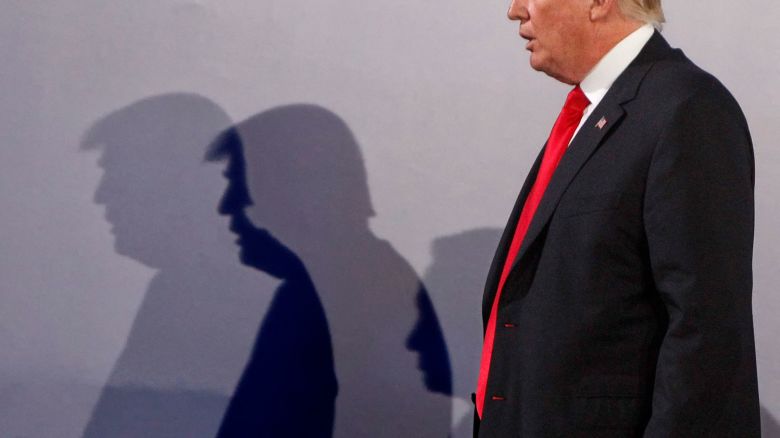 File -- In this Thursday, July 6, 2017 file photo U.S. President Donald Trump casts shadows on the wall as he walks with Poland's President Andrzej Duda at the end of a joint press conference, in Warsaw, Poland. Trump and Duda will meet at the White House on June 24, four days ahead of a presidential election in Poland in which Duda, a conservative, is seeking reelection. The meeting is expected to give Duda a boost, and is seen by some as election interference. (AP Photo/Czarek Sokolowski/file)
