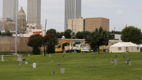 Workers sift through soil at the Oaklawn Cemetery during a 2020 excavation of a potential mass grave from the Tulsa Race Massacre.