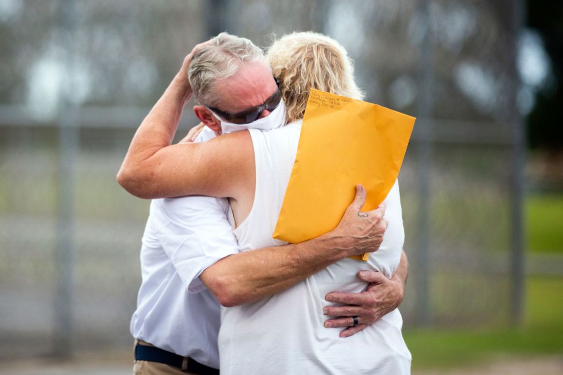 Dennis Perry is greeted by his wife Brenda in front of the Coffee Correctional Facility in 2020 after spending more than 20 years in prison for a crime he didn't commit.