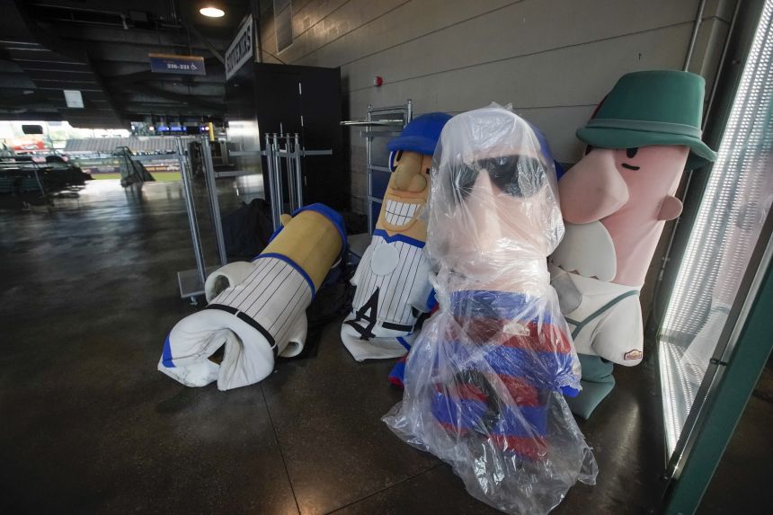 The sausage costumes sit on the concourse during a Brewers game in 2020.