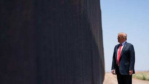 In this June 23, 2020, photo, President Donald Trump tours a section of the border wall in San Luis, Ariz.