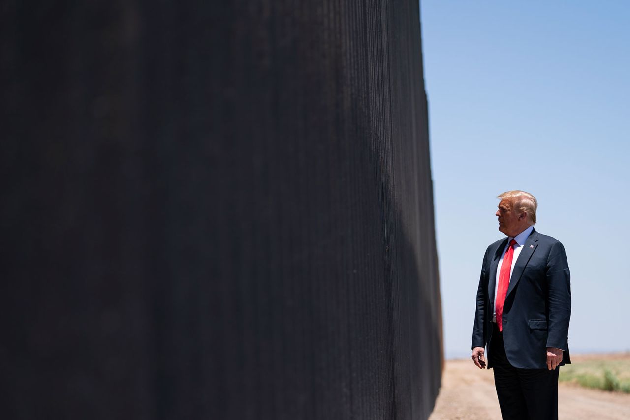 In this June 23, 2020, photo, President Donald Trump tours a section of the border wall in San Luis, Arizona.