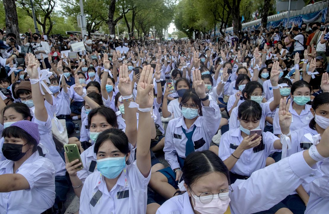 High school students raise the three-finger salute, a symbol of resistance, during a protest in Bangkok, Thailand, on September 5, 2020.