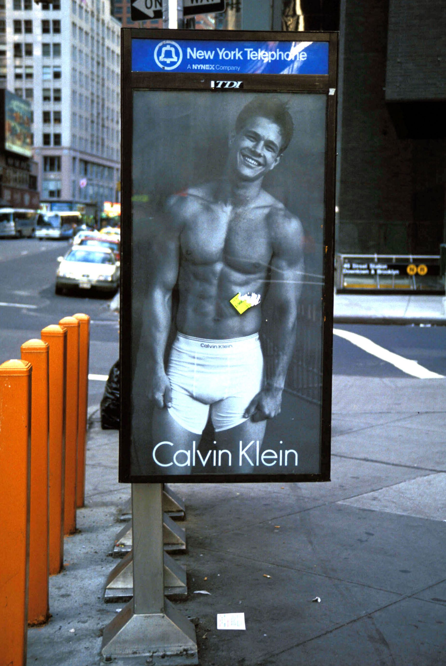 Adorning a New York City phonebooth, Mark Wahlberg is seen in a 1992 Calvin Klein campaign.