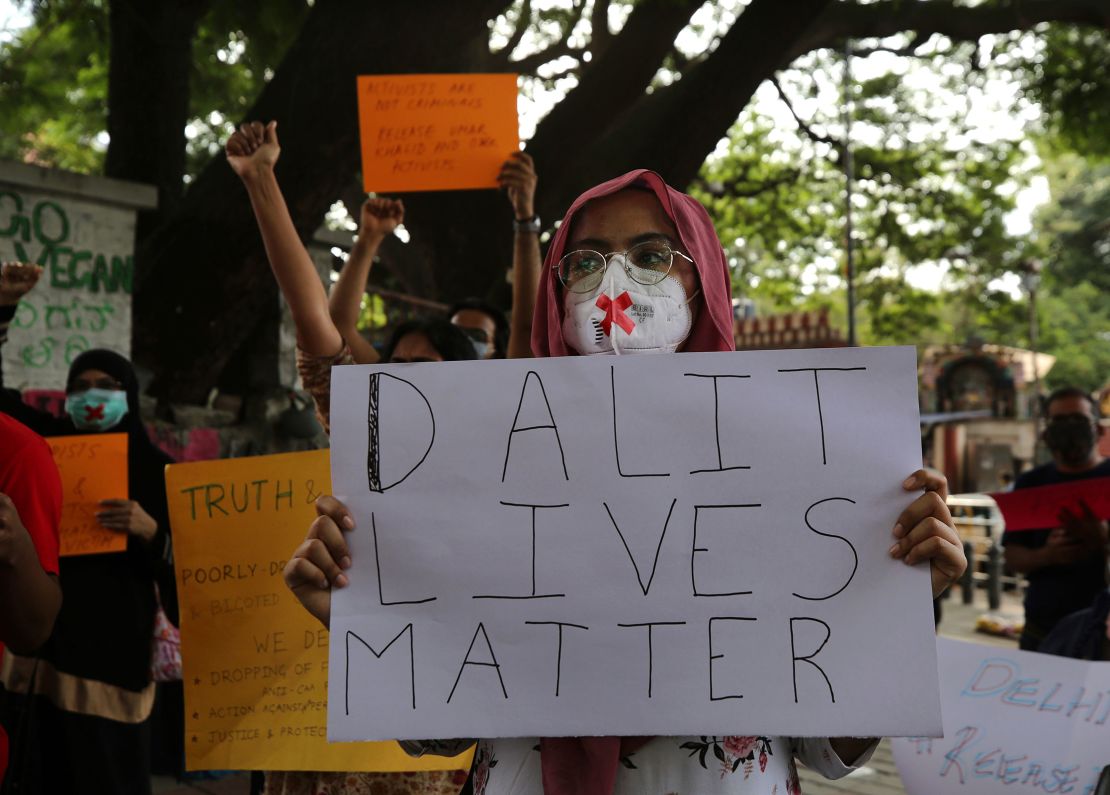 In this photo from 2020, protesters condemn the alleged gang rape and killing of a Dalit woman, in Bengaluru, India.