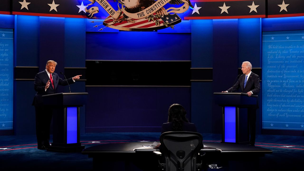 President Donald Trump, left, points towards Democratic presidential candidate former Vice President Joe Biden, right, during the second and final presidential debate Thursday, Oct. 22, 2020, at Belmont University in Nashville, Tenn. Seated in the center is moderator Kristen Welker of NBC News. (AP Photo/Patrick Semansky)