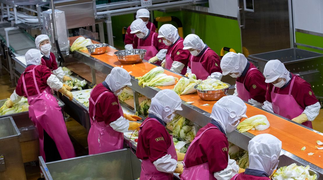 South Korean workers wash cabbage as they make kimchi at the Pulmuone Kimchi factory south of Seoul.