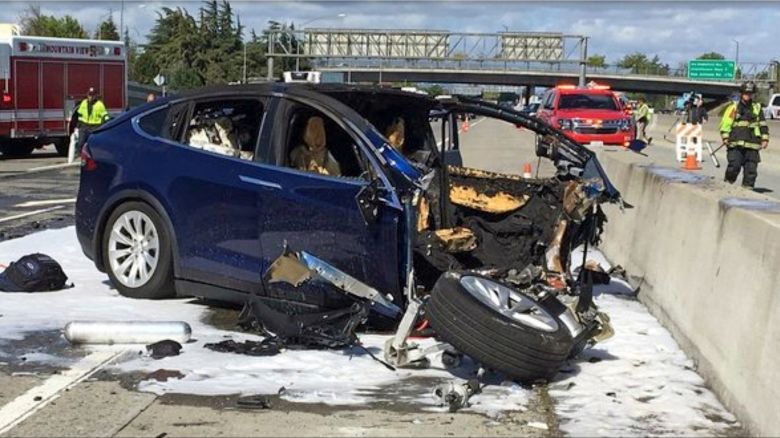 In this March 23, 2018, file photo provided by KTVU, emergency personnel work a the scene where a Tesla electric SUV crashed into a barrier on U.S. Highway 101 in Mountain View, Calif. The Apple engineer who died when his Tesla Model X crashed into the concrete barrier complained before his death that the SUV's Autopilot system would malfunction in the area where the crash happened. The driver of another Tesla involved in a fatal crash that California highway authorities said may have been on operating on Autopilot posted social media videos of himself riding in the vehicle without his hands on the wheel or foot on the pedal. The May 5, 2021, crash in Fontana, a city 50 miles (80 kilometers) east of Los Angeles, is also under investigation by the National Highway Traffic Safety Administration. The probe is the 29th case involving a Tesla that the federal agency has probed.