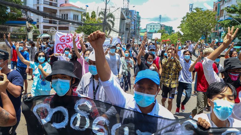 Anti-coup protesters march during a demonstration against the Myanmar junta's internet restrictions in Yangon on May 12, 2021.