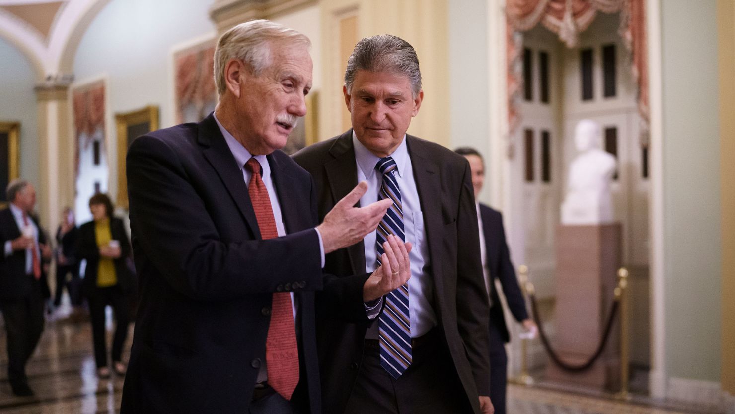 Independent Sens. Angus King of Maine and Joe Manchin of West Virginia walk to the chamber at the Capitol in Washington on May 28, 2021.