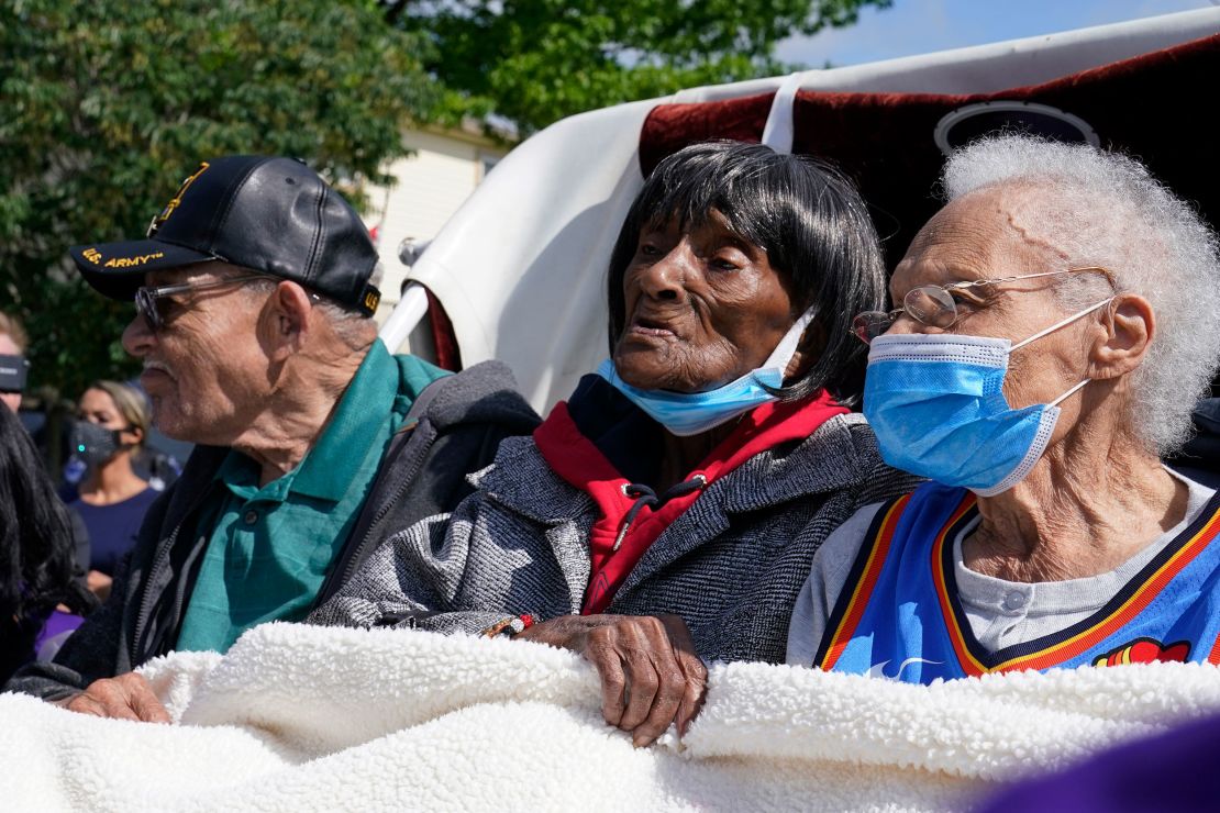 Viola Fletcher, right, the oldest living survivor of the Tulsa race massacre, waits with fellow survivors, her brother Hughes Van Ellis Sr., left, and Lessie Benningfield Randle, center, for a protest march Friday, May 28, 2021, in Tulsa, Oklahoma.