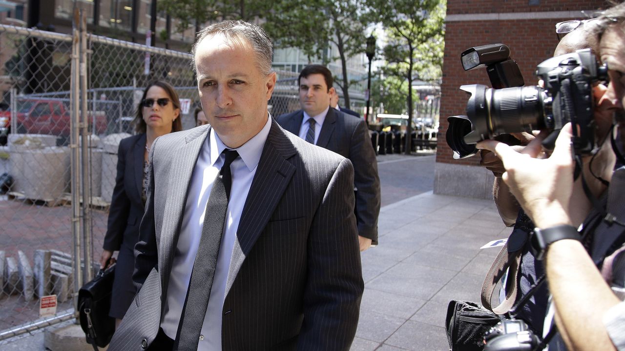 FILE - In this June 26, 2017, file photo, Barry Cadden, president of the New England Compounding Center, followed by members of his legal team, arrives at the federal courthouse for his sentencing in Boston. Cadden, founder of a now-defunct Massachusetts pharmaceutical facility responsible for a deadly meningitis outbreak, will spend 14 and a half years behind bars, a federal judge ruled Wednesday, July 7, 2021, lengthening his initial punishment of nine years that was tossed out by an appeals court. (AP Photo/Stephan Savoia, File)
