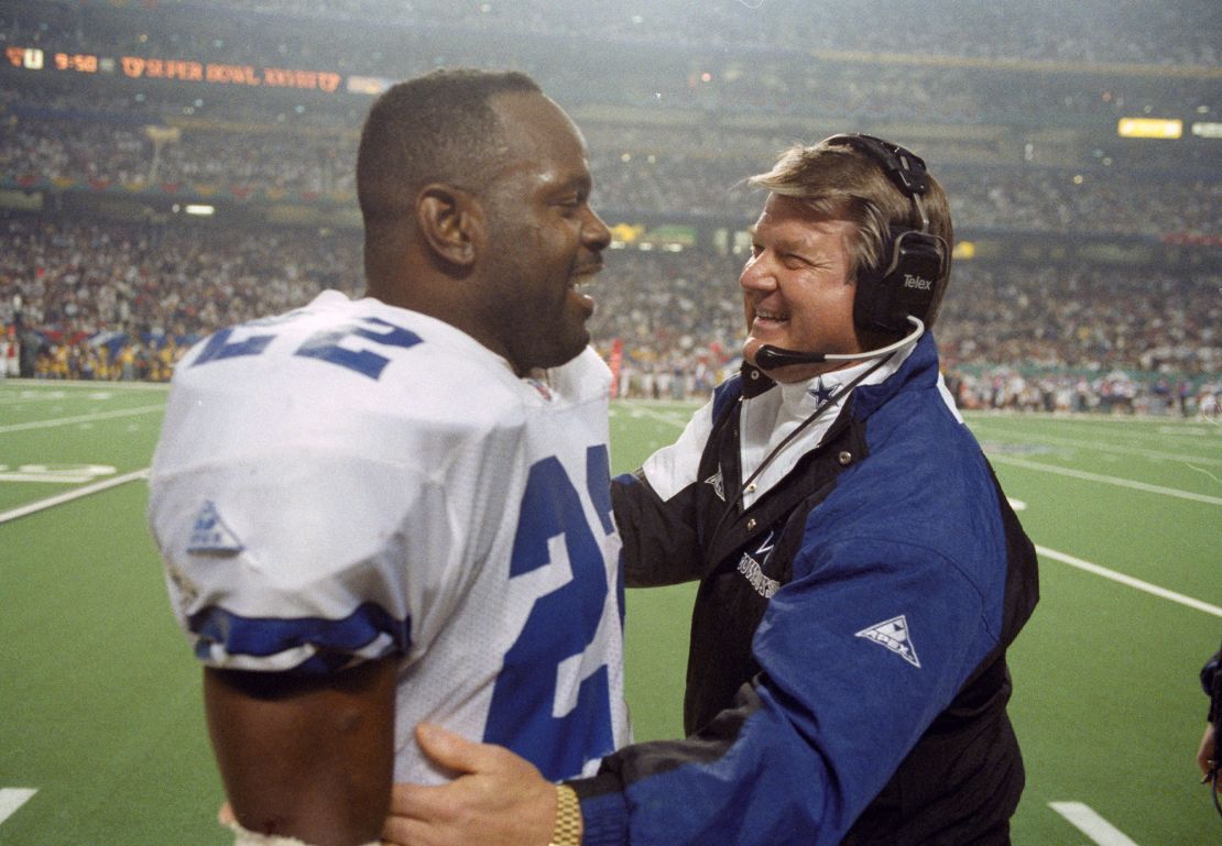 Then-Cowboys head coach Johnson is seen with running back Emmitt Smith during the Super Bowl in 1994.