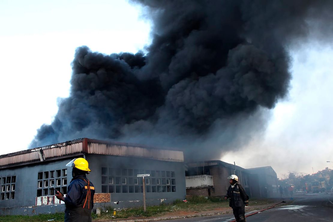 A factory burns on the outskirts of Durban, in July 2021, after former South African president Jacob Zuma's incarceration for contempt of court sparked the worst violence in the country in decades.