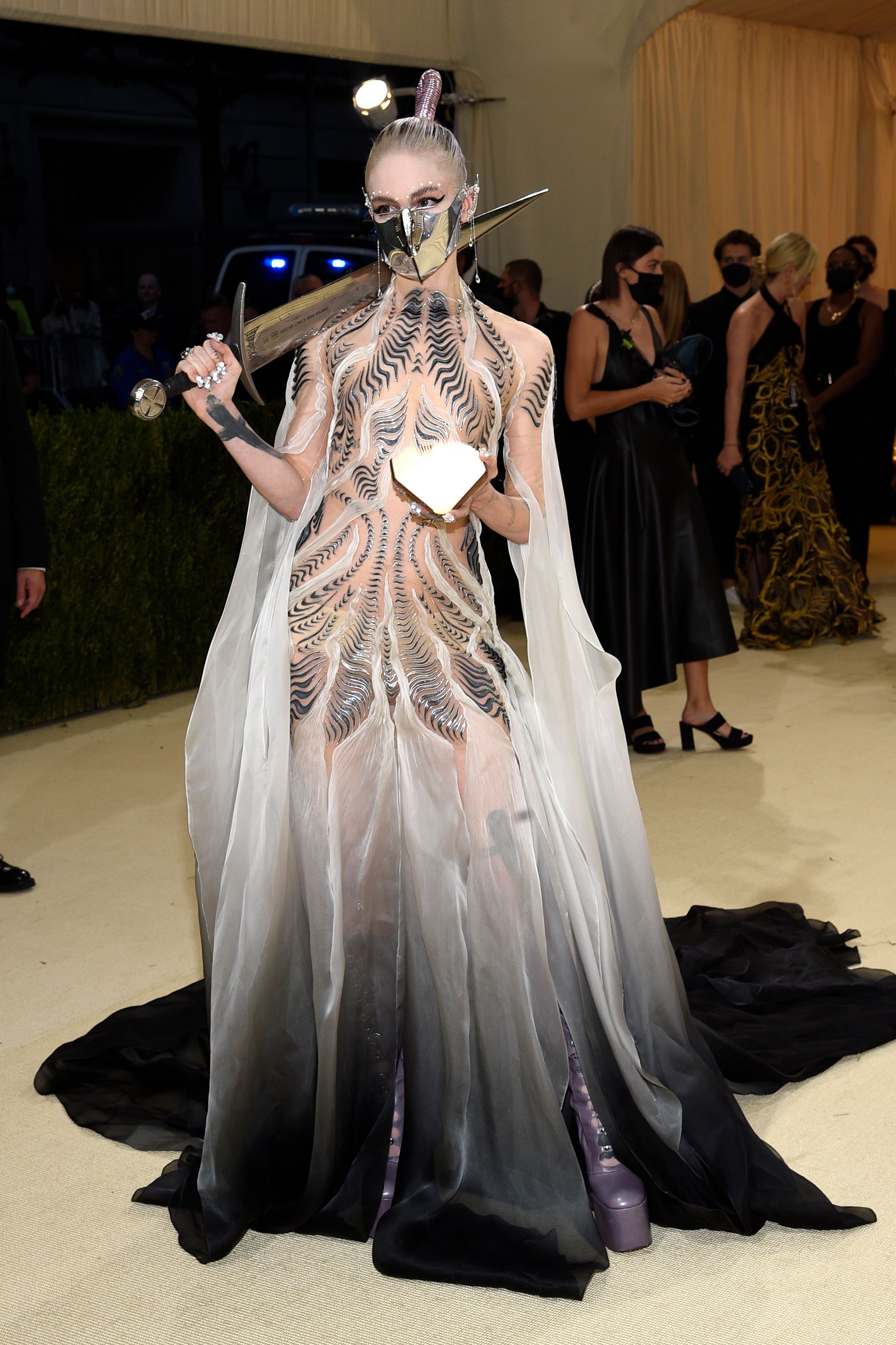 Musician Grimes attended the Met Gala in 2021 in a futuristic Iris van Herpen gown which took 900 hours to make.