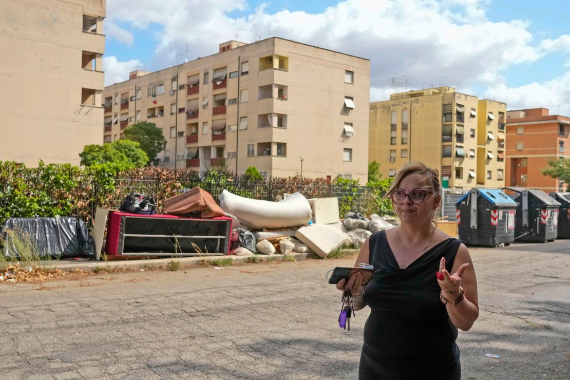 Anti-mafia activist Tiziana Ronzio walks through the Tor Bella Monaca district of Rome in 2021.