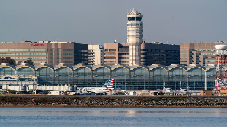 Passenger planes rest at Reagan National Airport in Washington, Thursday, Nov. 11, 2021.