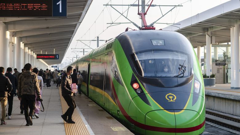 In this photo released by Xinhua News Agency, an electric multiple unit (EMU) train of the China-Laos Railway arrives at Yuxi Railway Station in Yuxi in southwestern China's Yunnan Province, Friday, Dec. 3, 2021. The China Laos railway is one of hundreds of projects under Beijing's Belt and Road Initiative to build ports, railways and other facilities across Asia, Africa and the Pacific. (Hu Chao/Xinhua via AP)