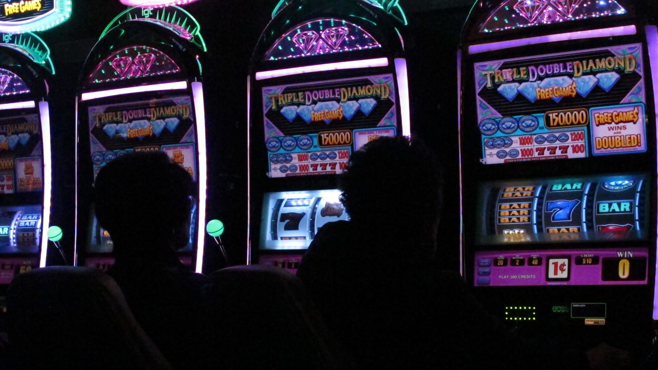 This March 9, 2016 photo shows gamblers playing slot machines at the Tropicana casino in Atlantic City, N.J.