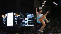 Red Panda perfumes at halftime catching bowls on her head while riding a unicycle during a game between the Vanderbilt Commodores and Kentucky Wildcats at Memorial Gymnasium in Nashville, Tennessee on  January 11, 2022.
